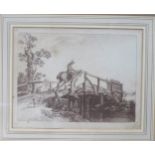 Framed monochrome engraved print, depicting a figure mounted on horseback crossing a bridge,