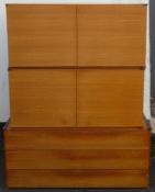 Pair of mid 20th century teak and melamine two door cupboards, plus similar chest