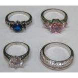 Four various pretty white metal ladies dress rings, set with various coloured stones