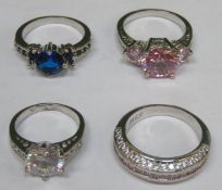 Four various pretty white metal ladies dress rings, set with various coloured stones