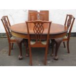 Early 20th century piecrust edged mahogany wind out extending dining table with two leaves, and four