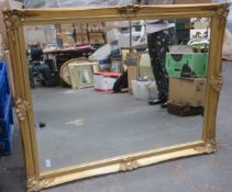 20th century gilded and bevelled wall mirror. App. 91 x 115cm