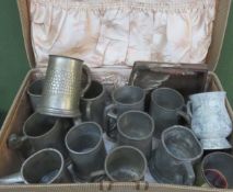 Case containing pewter tankards and other sundries