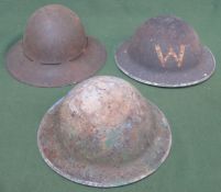 Three various military helmets