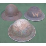 Three various military helmets