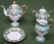 Four pieces of heavily gilded and floral decorated Noritake china.