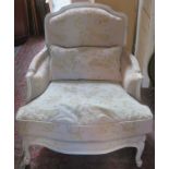 French style upholstered and carved framed low seated armchair. App. 91cm H x 86cm W x 102cm D