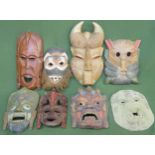 Eight various handpainted and carved treen tribal style wall masks