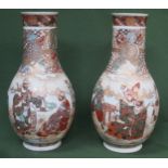 Pair of heavily gilded hand painted ceramic vases, decorated with oriental figures throughout.
