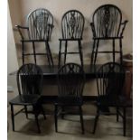 Ercol dining table plus six (4+2) wheel back chairs.