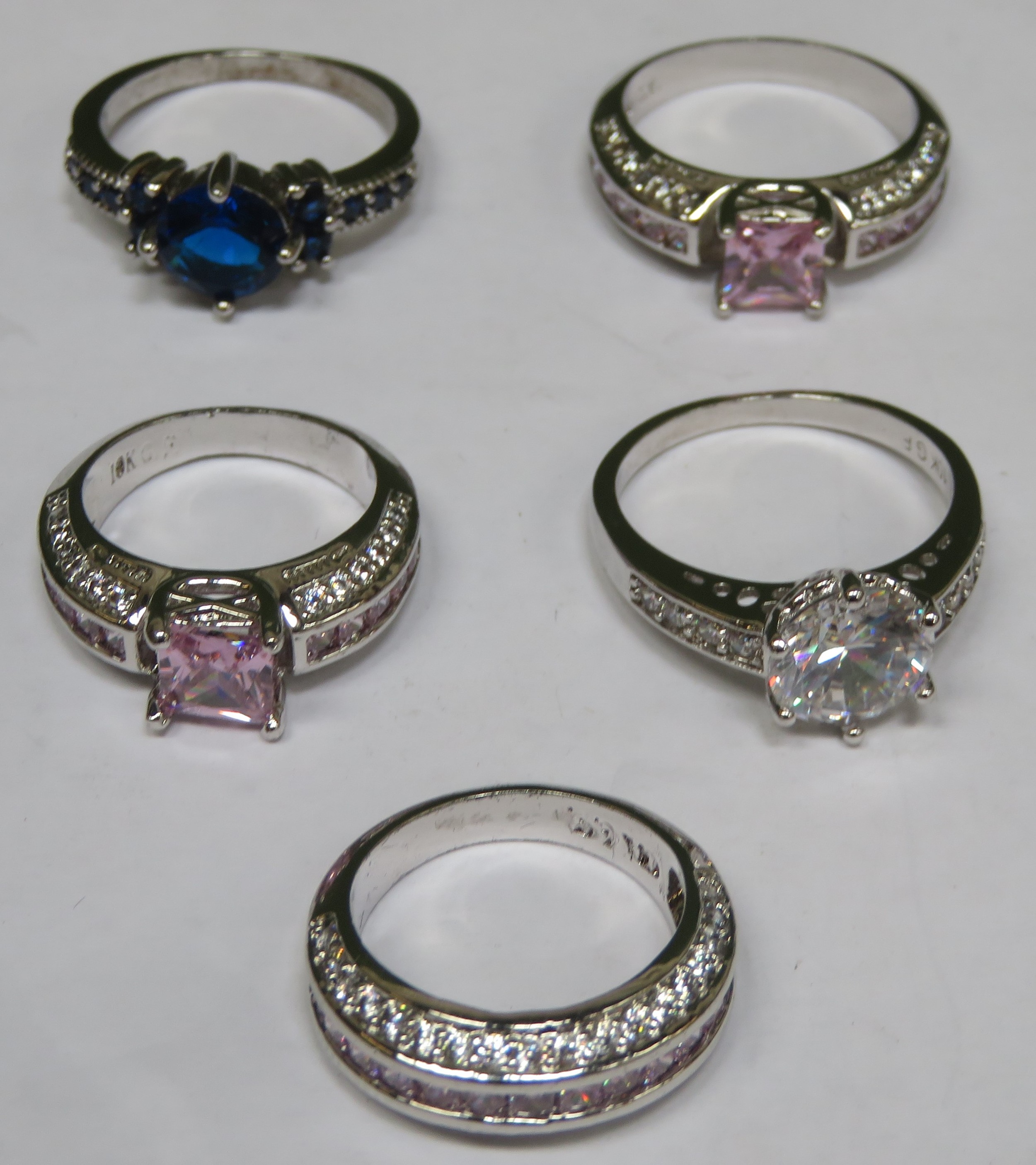 Five various pretty white metal ladies dress rings, set with various coloured stones