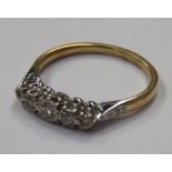 Unhallmarked Victorian Gold and Platinum set dress ring, with five small diamonds