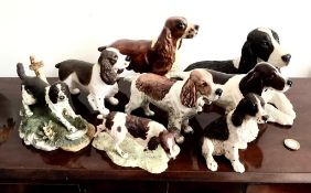 ONE BESWICK AND SEVEN VARIOUS DOG FIGURES, RESIN AND UNKNOWN POTTERIES