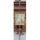 19th century mahogany adjustible pole screen on tripod supports, with gilded embroided religious