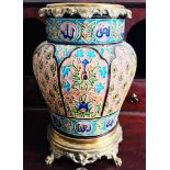 MAJOLICA TYPE GLAZED VASE IN MIDDLE EASTERN STYLE UPON BRASS STAND AND BRASS DECORATIVE RIM AND