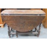 Early Antique Oak gateleg dining table on bobbin supports. Approximately. 71cm H x 106cm W x 126cm D