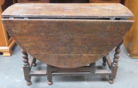 Early Antique Oak gateleg dining table on bobbin supports. Approximately. 71cm H x 106cm W x 126cm D