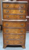 20th century Walnut veneered bow fronted Seven drawer chest on chest. Approximately. 110cm H x