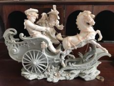 FINELY MODELLED CONTINENTAL BISQUE FIGURE GROUP- 'THE ROCKING HORSE CARRIAGE', APPROXIMATELY 38cm