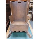 Childs antique oak rocking chair. Approximately. 58cm H x 34cm W