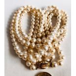 CULTURED PEARL THREE STRAND NECKLACE HAVING 9ct GOLD CLASP