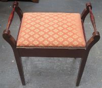 Early 20th century mahogany two handled piano stool with hinged lift up seat. Approximately. 62cm