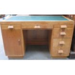 Art Deco style oak kneehole writing desk with leather inserts. Approximately. 76cm H x 121.5cm W x