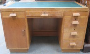 Art Deco style oak kneehole writing desk with leather inserts. Approximately. 76cm H x 121.5cm W x