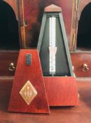 MAHOGANY COLOURED CASED CONTEMPORARY METRONOME BY WITTER, APPROXIMATELY 22cm HIGH