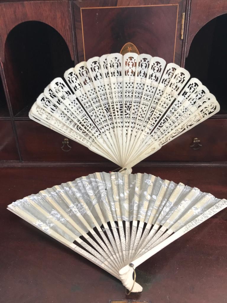 FINELY WORKED BONE FAN, ALSO PAPER FAN WITH SILVERED DECORATION