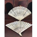 FINELY WORKED BONE FAN, ALSO PAPER FAN WITH SILVERED DECORATION