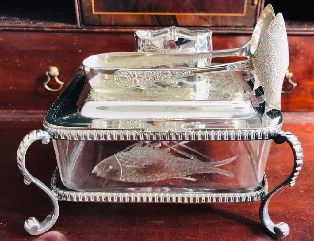 GLASS SARDINE DISH WITHIN SILVER PLATED STAND AND COVER, ALSO SARDINE TONGS AND PLATED NAPKIN RING