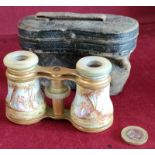 PAIR OF LATE 19th CENTURY GILT METAL AND MOTHER OF PEARL OPERA GLASSES WITH ENAMELLED DECORATION