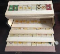 CARDBOARD STORAGE BOX CONTAINING APPROXIMATELY EIGHTY MICROSCOPIC SLIDES, POSSIBLY CIRCA 1920s