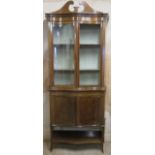 19th century mahogany inlaid serpentine fronted display cabinet. Approx. 225cms H x 86cms W