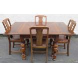 Early 20th century oak draw leaf dining table plus four chairs. Approx. 74cm H x 148cm W x 90cm D