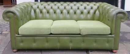 Green leather effect upholstered button back Chesterfield settee. Approx. 70cm H x 190cm W x 92cm D