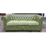 Green leather effect upholstered button back Chesterfield settee. Approx. 70cm H x 190cm W x 92cm D