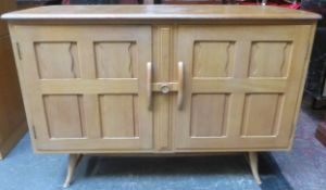 Ercol mid 20th century oak two door sideboard. Approx. 83cm H x 123cm W 49cm D