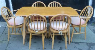 Ercol mid 20th century light oak dining table, plus six (4+2) chairs