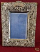 HALLMARKED SILVER RELIEF DECORATED PHOTO FRAME, BIRMINGHAM ASSAY DATED 1901, APPROXIMATELY 24 x 18.