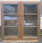 Ercol mid 20th century oak two door glazed display cabinet/bookcase. Approx. 97cms H x 91cms W x