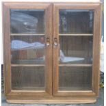 Ercol mid 20th century oak two door glazed display cabinet/bookcase. Approx. 97cms H x 91cms W x