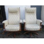 Pair of Ercol mid 20th century oak framed upholstered swivel armchairs. Approx. 114cms H