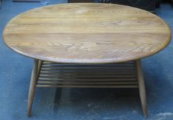 Ercol mid 20th century light oak oval coffee table. Approx. 44cm H x 99cm W x 82.5cm D