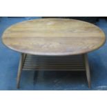 Ercol mid 20th century light oak oval coffee table. Approx. 44cm H x 99cm W x 82.5cm D