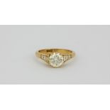 A lovely 18ct yellow gold ring set with a centre solitaire diamond (approx 1.5ct) with diamond set