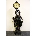 A large Victorian style resin figure holding a clock, H. 84cm.