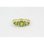 A 9ct yellow gold peridot and diamond set ring, approx. 2.1gr, (N.5).