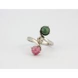 A French 18ct white gold ring set with a brilliant cut diamond and pink and green cabochon cut